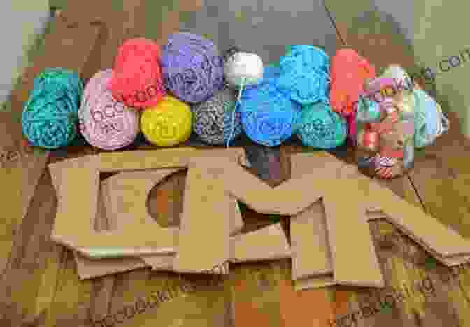 Yarn Wrapped Letters Spelling Out The Word 35 Summer Crafts For Kids + 2 Free